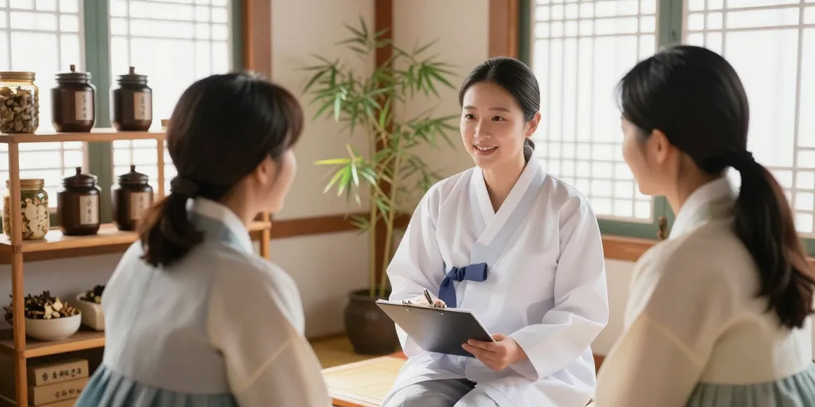 Consultation at 수원한의원 with a practitioner discussing herbal treatments in a calm setting.